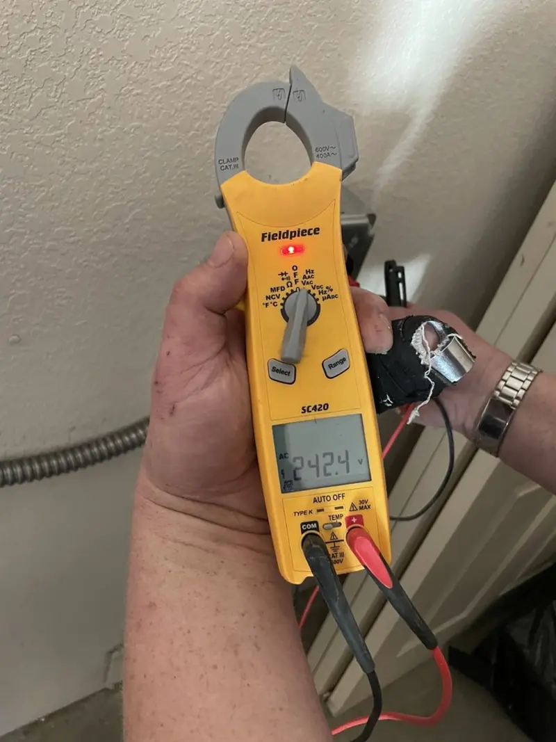 Voltage testing with clamp meter during Outlet Installation in St. Gabriel